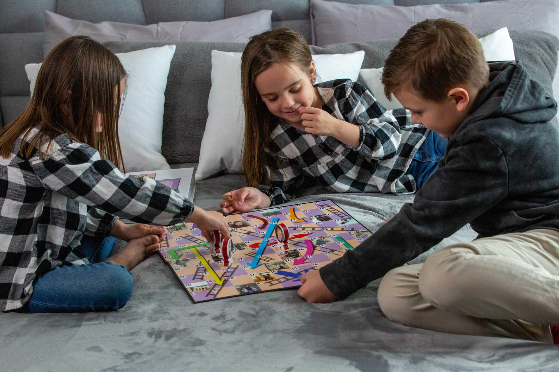 Family playing a customized Chutes and Ladders board game | You're On Deck